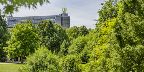 The mathematics building with green trees in the foreground.